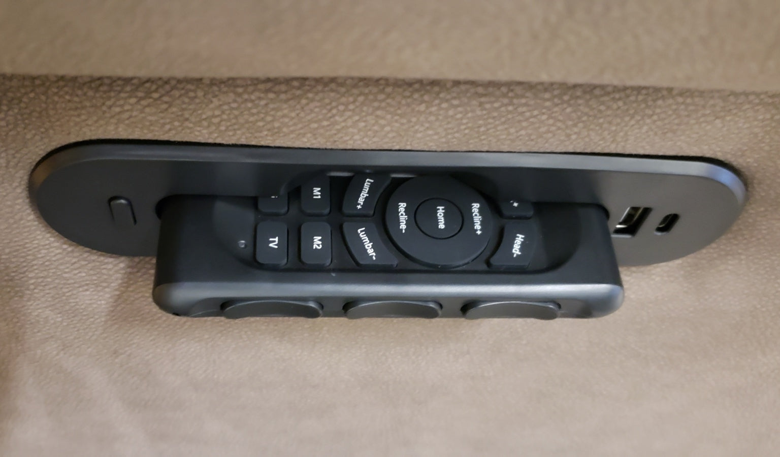 Wireless remote being removed from side panel.